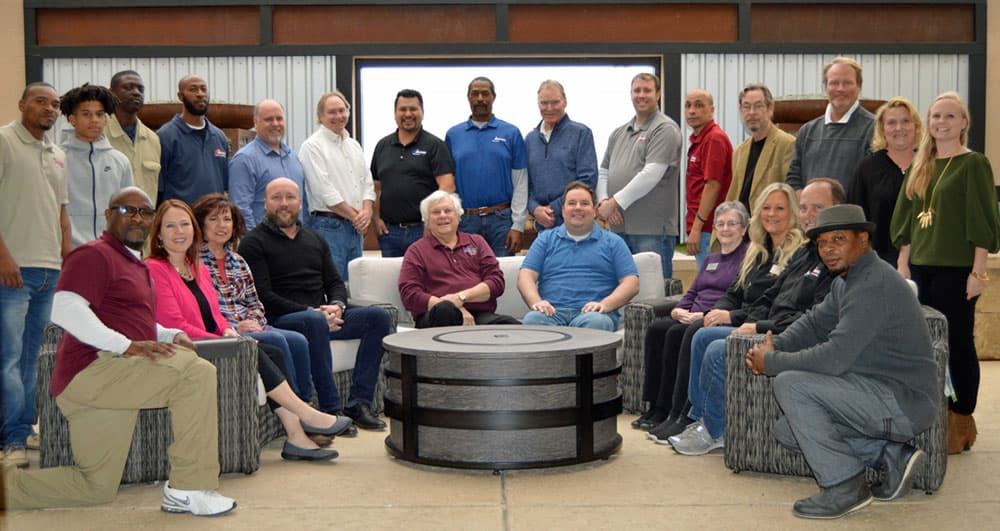 The Sunnyland Outdoor Living Team posing in the company showroom. 