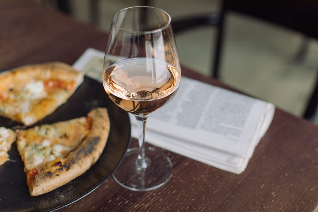 Wine glass and pizza