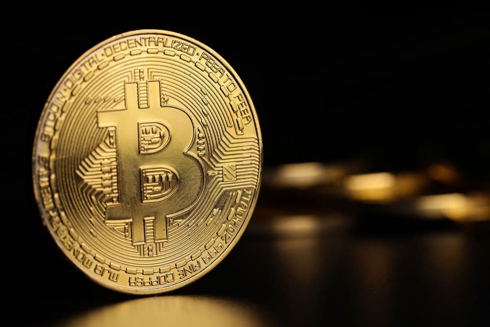 A gold Bitcoin representing the digital cryptocurrency. 