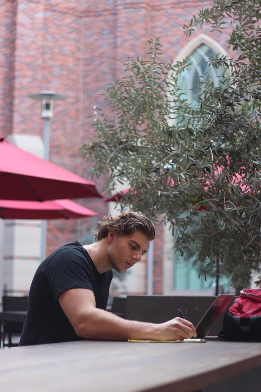 Andrew Koslovski studying outside at the USC campus.